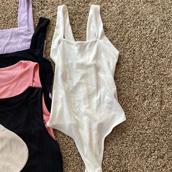 NEW size large but runs more like medium, and a body suit size small.  Lot of 4 - Picture 2 of 9